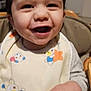 Maël participe au concours pour gagner de l'argent avec cette photo : baby, babylaughing, bib, bodypart, chair, cutlery, face, furniture, happy, head, laughing, mouth, person, photography, portrait, sitting, smile, spoon, table, teeth