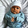 Taio joined the competition — help win amazing prizes! baby, infant, hat, blue_clothing, white_blanket, cute, sleepwear, animal_print, lying_down, portrait, child, soft_texture, indoor, small_hands, face, looking_away, newborn, cozy, warm, adorable