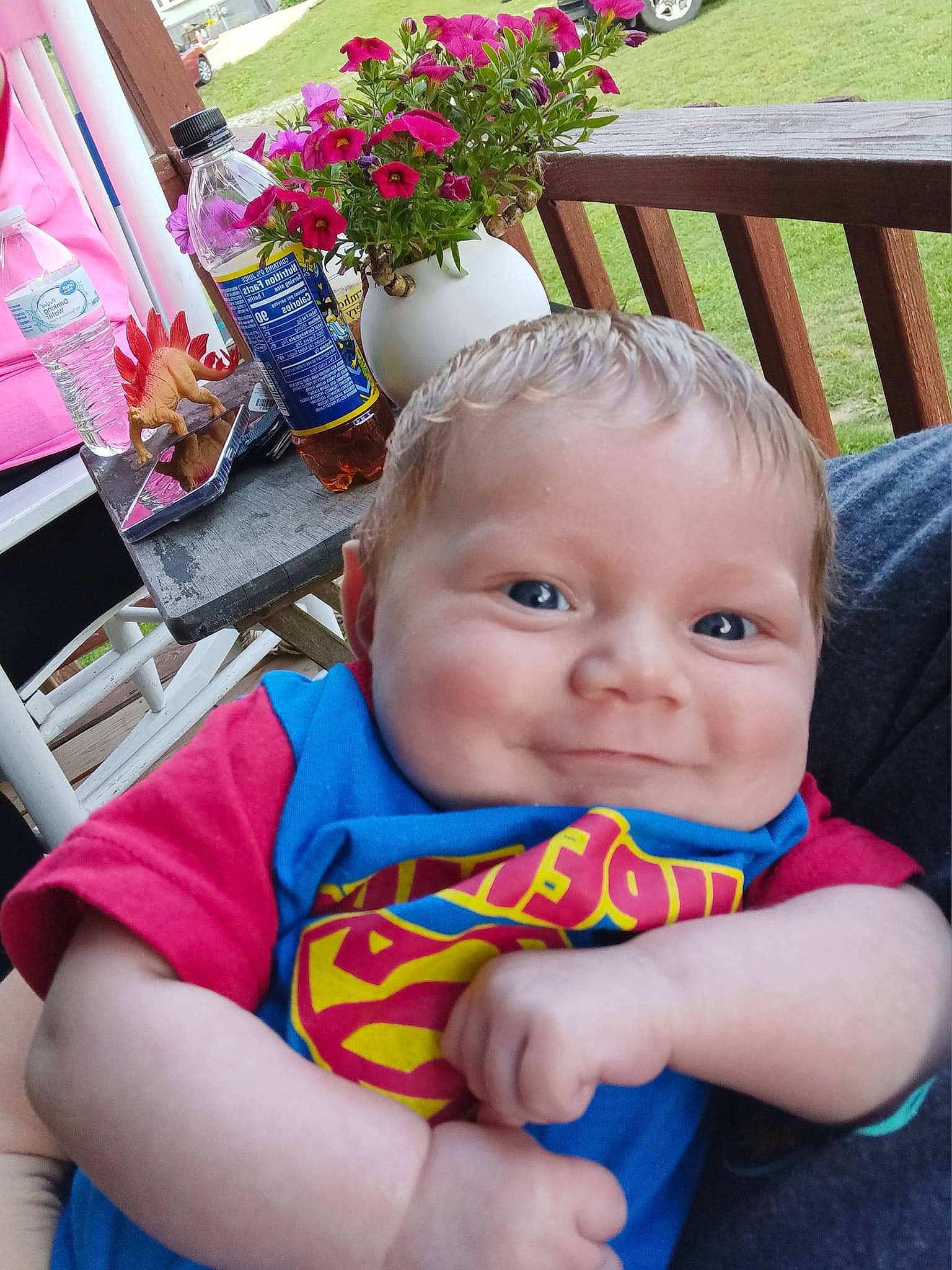 Carter joined the competition — help win amazing prizes! baby, baby_products, baby_toddler_clothing, chair, child, electric_blue, event, flower, flowerpot, fun, garden, grass, happy, leisure, orange, person, plant, sitting, smile, summer