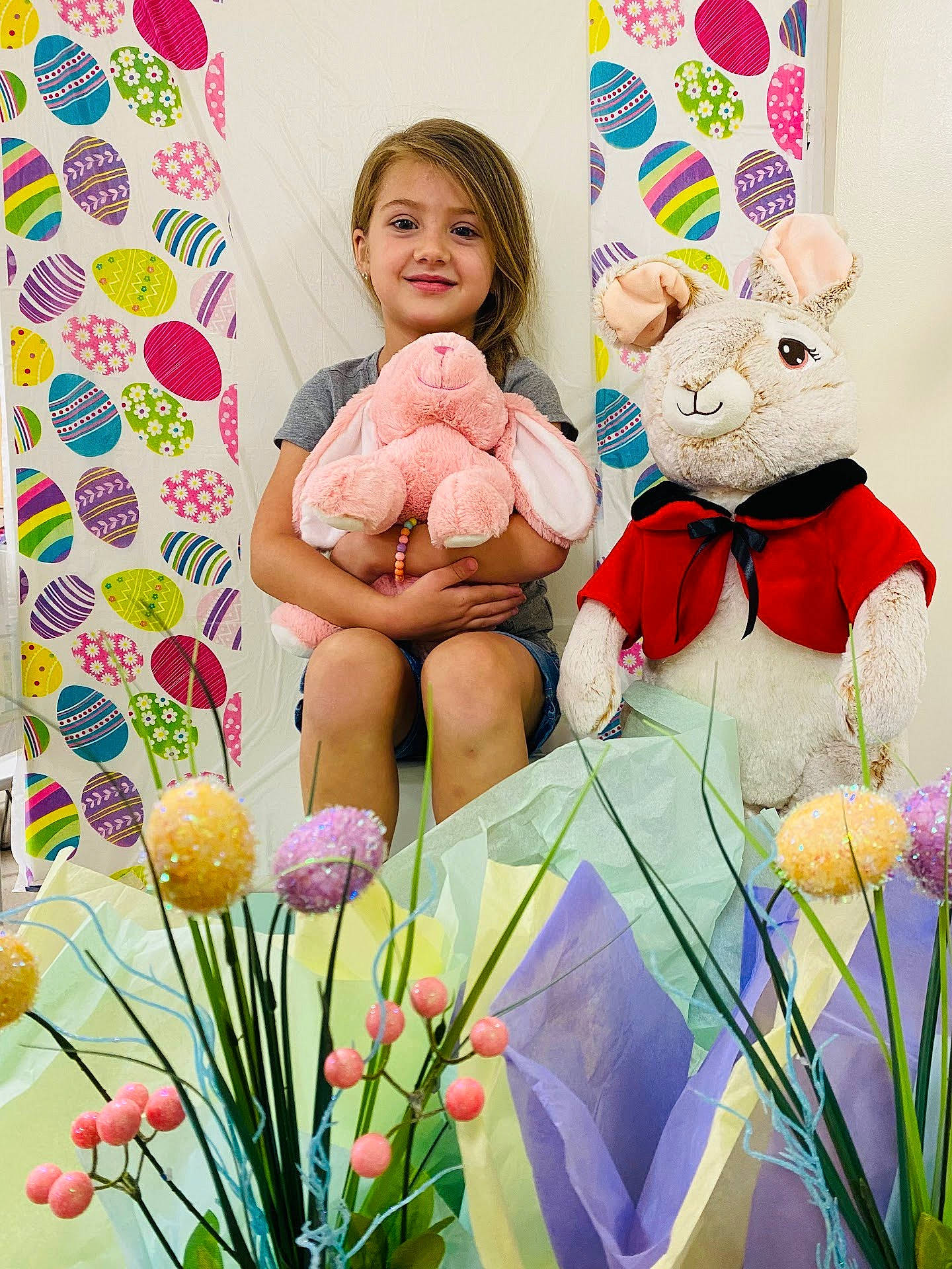 Hailey joined the competition — help win amazing prizes! baby_toddler_clothing, couch, cut_flowers, event, floristry, flower, flower_arranging, grass, green, happy, joy, linens, person, petal, pillow, pink, plant, room, teddy_bear, textile