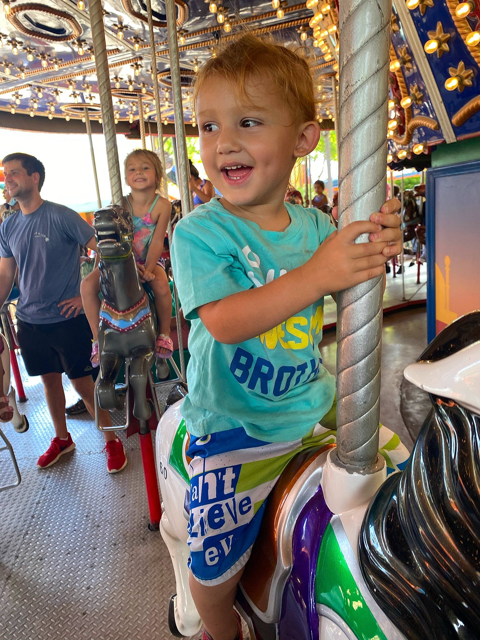 Brayden joined the competition — help win amazing prizes! amusement_ride, automotive_tire, child, event, fun, happy, joy, leisure, motorcycle_helmet, nonbuilding_structure, organ, person, personal_protective_equipment, play, playground, recreation, shorts, smile, standing, t_shirt