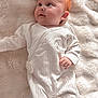 baby, infant, red_hair, white_onesie, blanket, soft_texture, lying_down, cute, child, portrait, face, skin, hand, foot, sleepwear, cozy, innocence, looking_up, comfort, young
