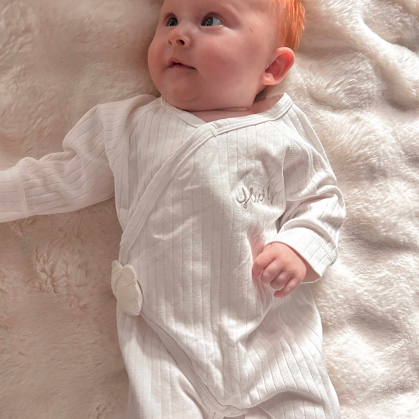 Felicity joined the competition — help win amazing prizes! baby, blanket, child, comfort, cozy, cute, face, foot, hand, infant, innocence, looking_up, lying_down, portrait, red_hair, skin, sleepwear, soft_texture, white_onesie, young