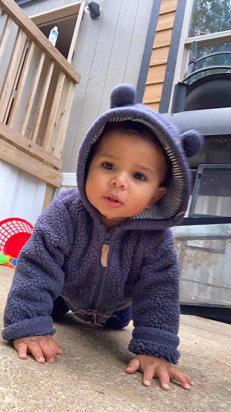 Mateo joined the competition — help win amazing prizes! cap, cheek, child, chin, city, cool, flooring, fun, happy, headgear, headwear, jacket, nose, person, sitting, skin, sleeve, smile, temple, toddler