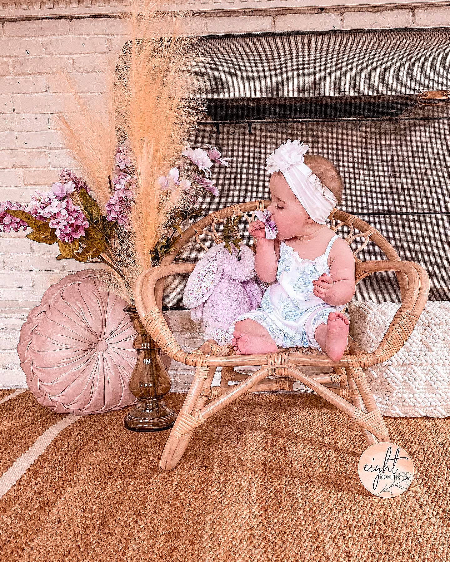 Maggie is registered to the contest to win money with this photo: art, baby, comfort, fashion_accessory, fawn, flooring, flower, happy, hat, headgear, headpiece, headwear, magenta, pattern, peach, person, pink, room, sitting, twig