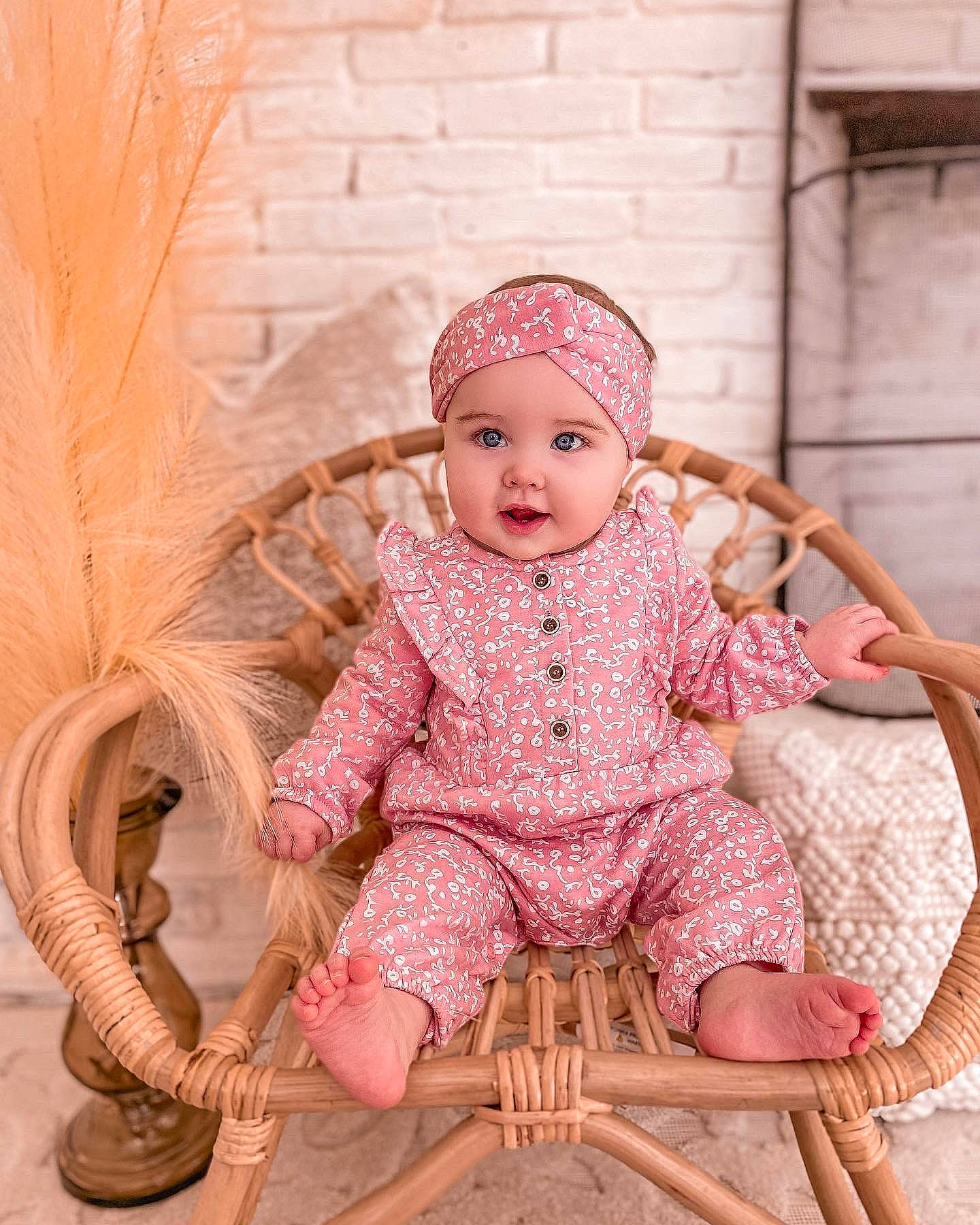 Maggie joined the competition — help win amazing prizes! baby, baby_toddler_clothing, cap, chair, dress, embellishment, happy, head, headgear, headwear, magenta, outerwear, pattern, peach, person, pink, skin, sleeve, smile, textile