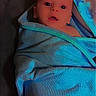Eli joined the competition — help win amazing prizes! baby, infant, child, face, portrait, wide_eyed, indoors, wrapped, blanket, turquoise, blue, cozy, sleeping, lying_down, close_up, head, eyes, mouth, textile, dramatic_lighting