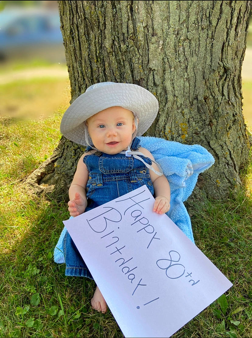 Sebastian joined the competition — help win amazing prizes! baby_toddler_clothing, cap, child, dress, grass, green, handwriting, happy, hat, headwear, leaf, nature, people, people_in_nature, person, plant, standing, summer, sun_hat, toddler