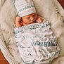 baby, basket, bed, blanket, bonnet, clothing, crib, face, furniture, hat, head, infantbed, newborn, person, photography, portrait, sleeping