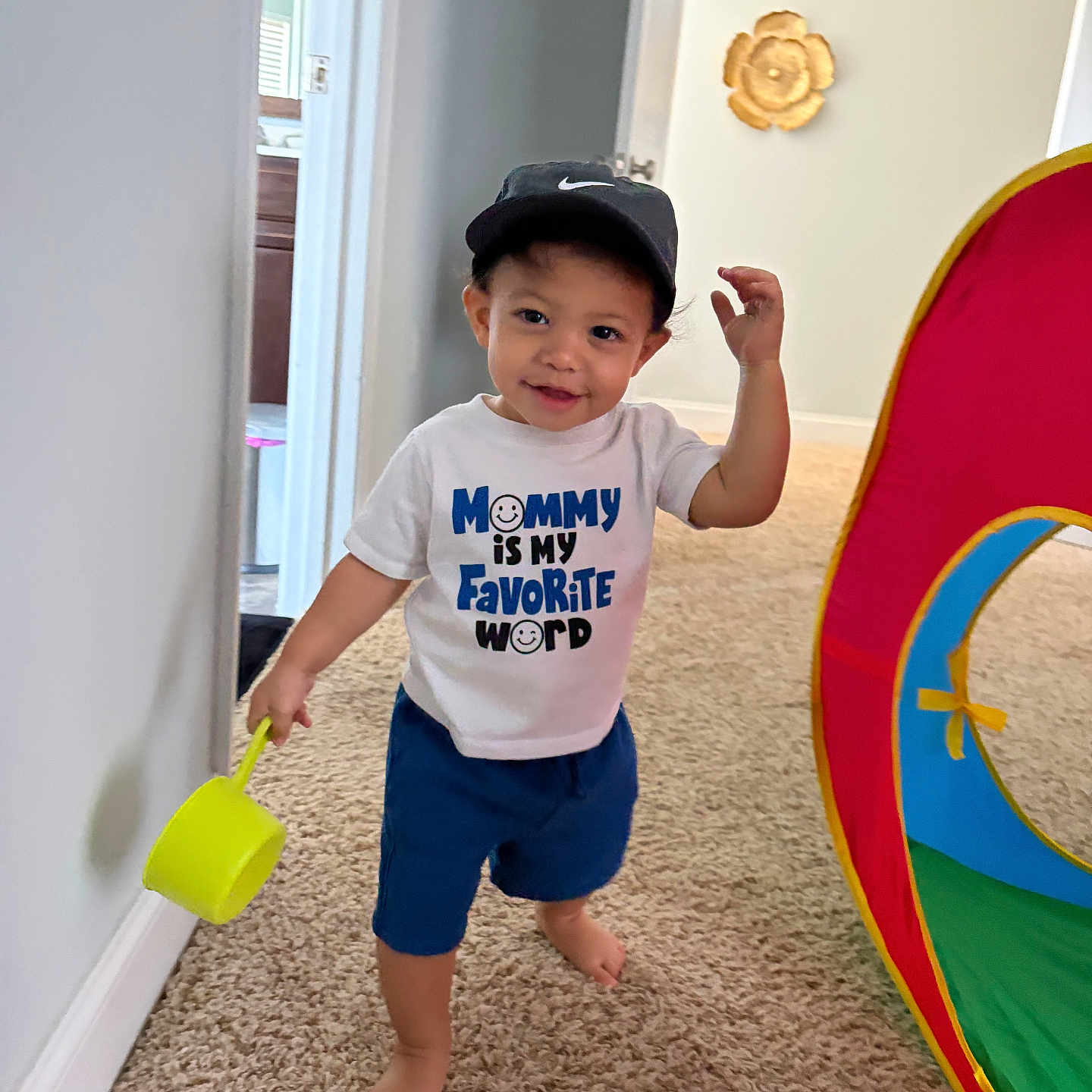 Carmelo is registered to the contest to win money with this photo: toddler, child, indoor, carpet, toy, cap, tshirt, smile, play, tent, person, barefoot, home, room, colorful, cute, young_child, happy, wall, floor