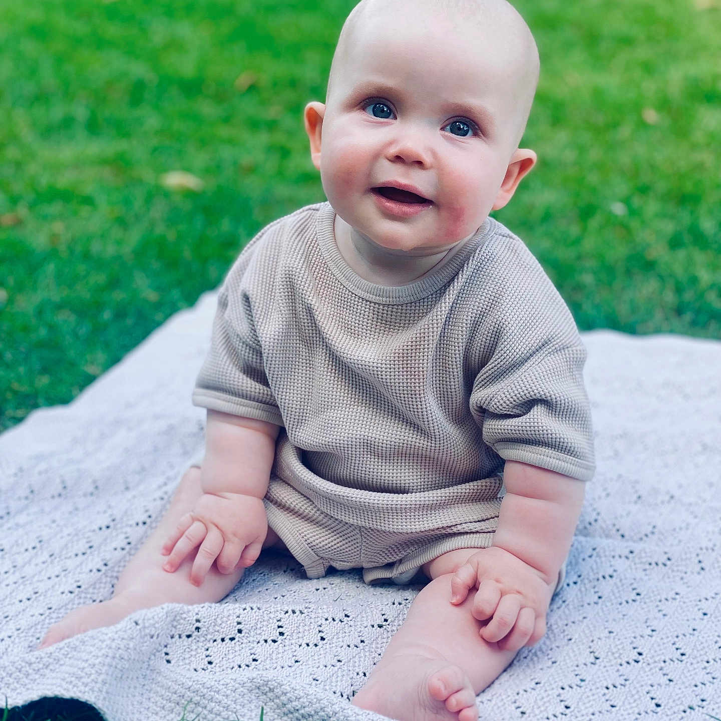 Bertie is registered to the contest to win money with this photo: baby, babylaughing, bodypart, clothing, crawling, dress, face, finger, grass, hand, happy, head, lawn, pants, person, photography, plant, portrait, sitting, smile