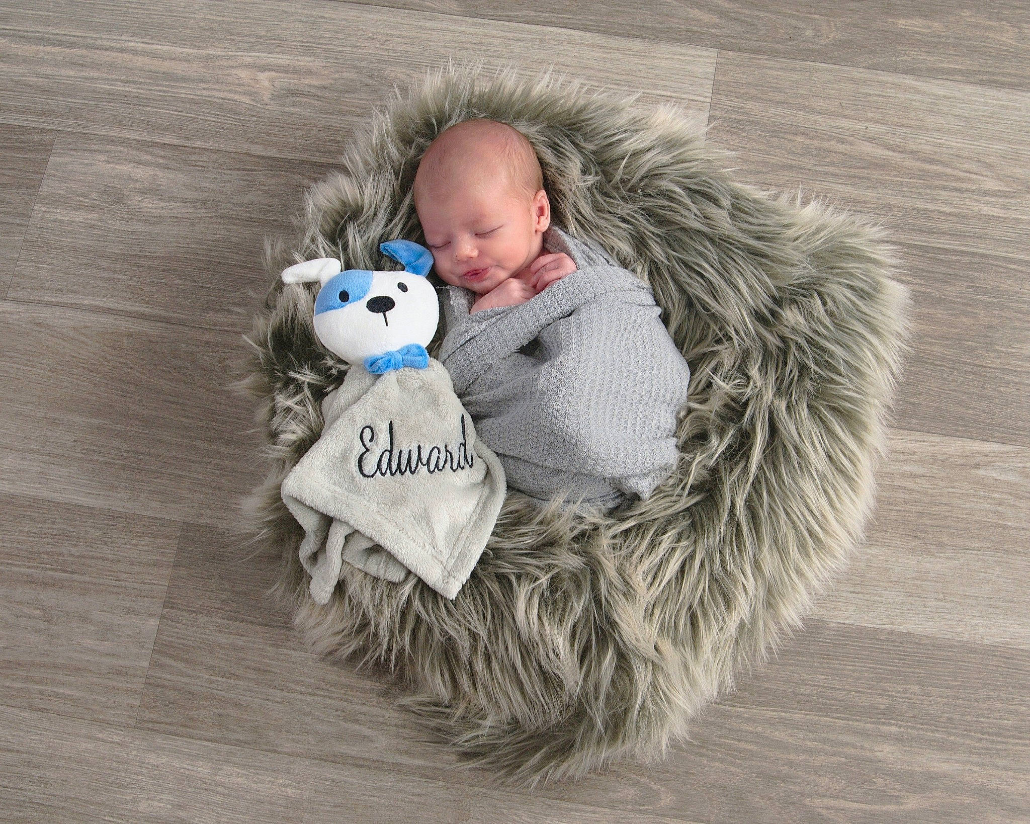 Edward joined the competition — help win amazing prizes! baby, baby_toddler_clothing, comfort, flooring, freezing, fur, fur_clothing, grass, grey, happy, person, plush, sitting, stuffed_toy, teddy_bear, textile, toddler, toy, winter, wood
