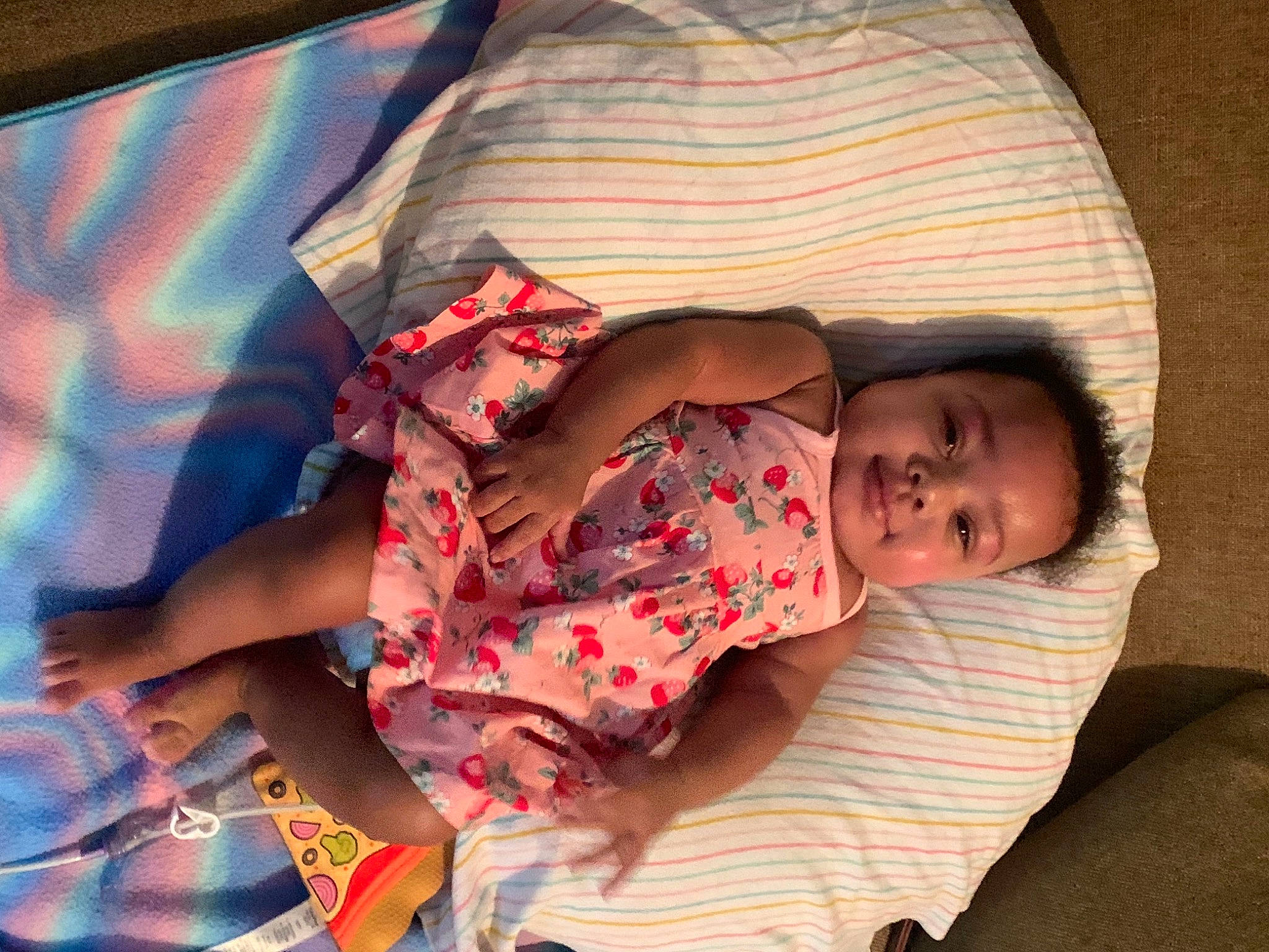 Alana is registered to the contest to win money with this photo: abdomen, baby, child, comfort, elbow, finger, fun, happy, human_body, human_leg, linens, mouth, muscle, pattern, person, skin, sleeve, textile, thigh, toddler