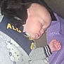 Hudson joined the competition — help win amazing prizes! baby, sleeping, cat, black_cat, couch, blanket, cozy, child, indoor, cute, pet, nap, soft, purple_blanket, clothing, face, hand, fur, rest, toddler