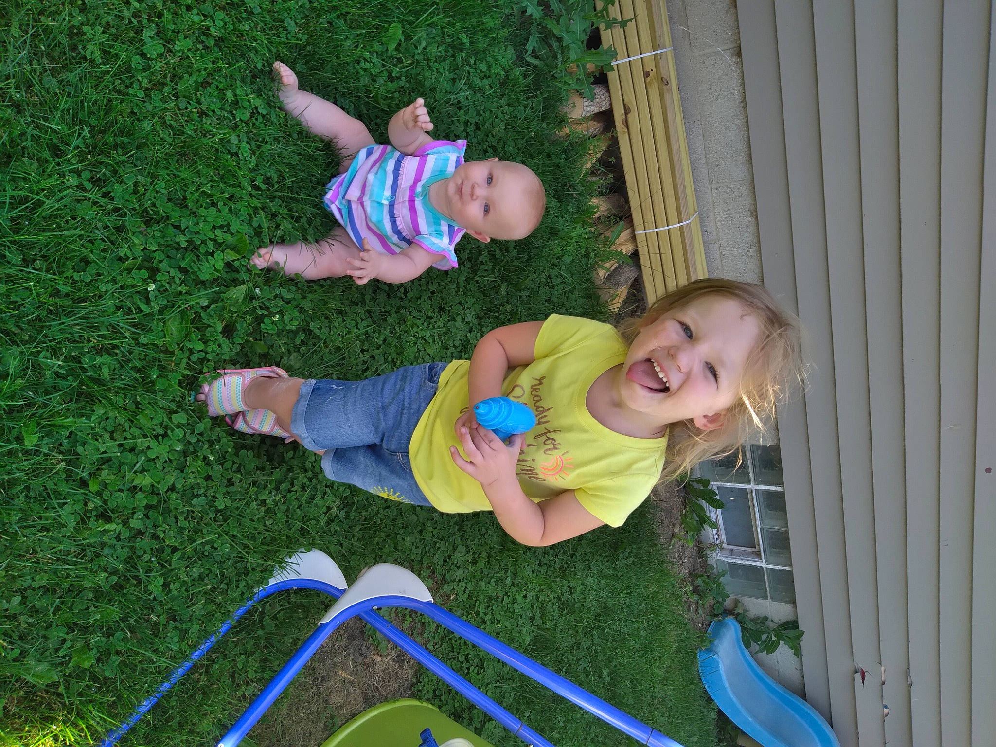 Laylah is registered to the contest to win money with this photo: baby, baby_laughing, baby_toddler_clothing, child, face, fun, grass, green, groundcover, happy, lawn, leisure, people_in_nature, person, play, recreation, shorts, sitting, smile, toddler