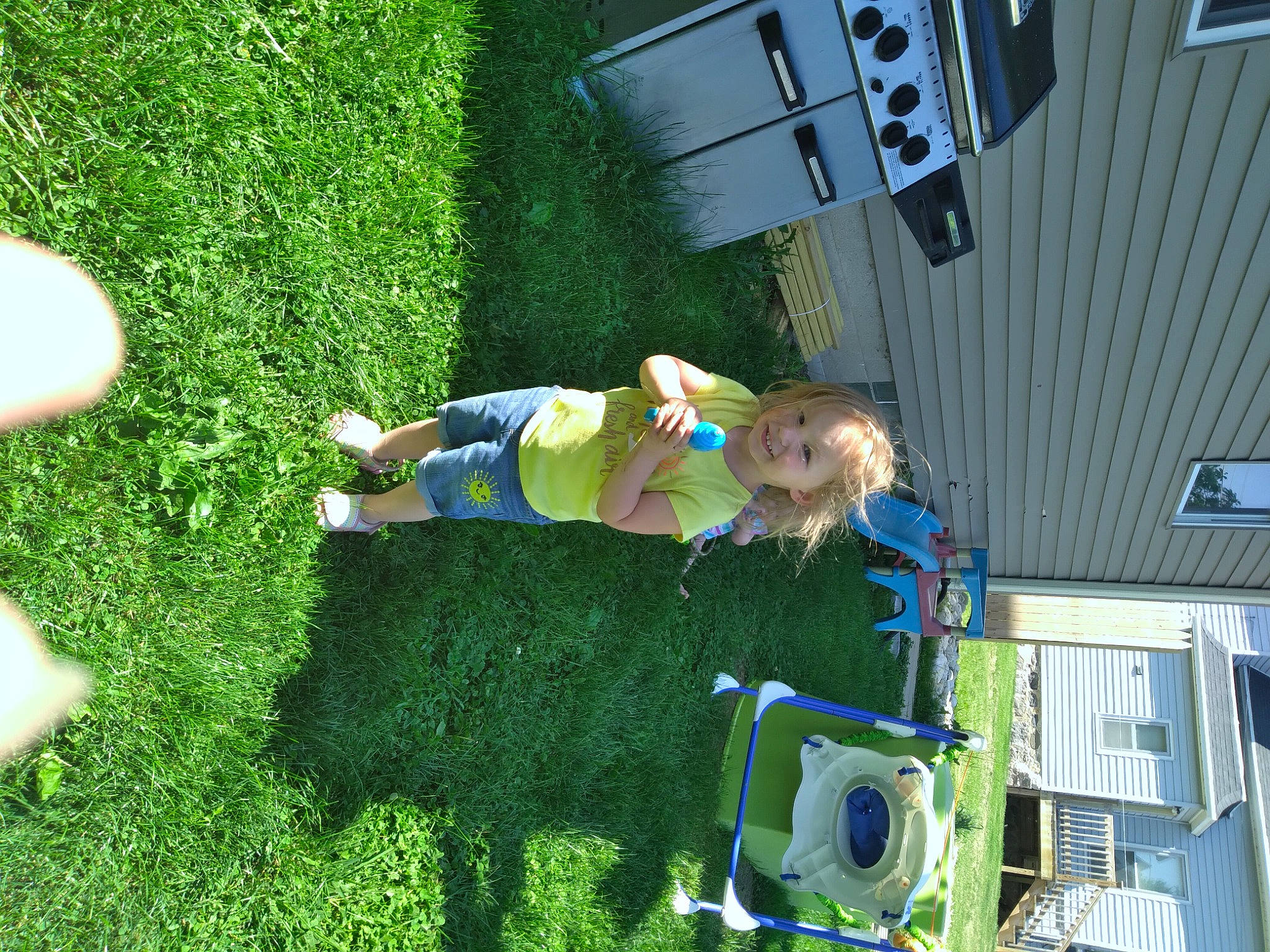 Laylah joined the competition — help win amazing prizes! baby, child, fun, grass, grassland, green, groundcover, house, joy, leisure, people_in_nature, person, plant, play, recreation, shorts, shrub, t_shirt, toddler, tree