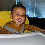 Julian joined the competition — help win amazing prizes! baby, milk, high_chair, smile, happy, child, face, hair, brown_clothing, indoor, window_blinds, feeding, infant, toddler, seatbelt, table, mouth_open, tongue_out, skin, expression
