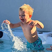 Oliver joined the competition — help win amazing prizes! child, boy, water, splash, pool, swimwear, happy, summer, outdoor, playing, fun, excited, blond, wet, splashing, water_droplets, swimming_pool, sunlight, bare_chested, joy