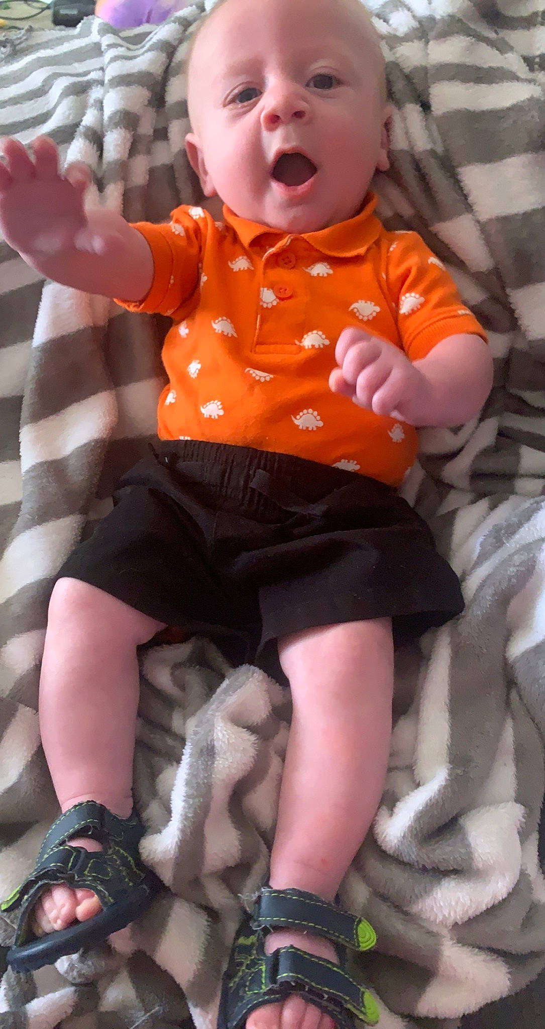 Atlas is registered to the contest to win money with this photo: baby, baby_toddler_clothing, black, cool, dress, eye, finger, happy, human, joint, knee, lap, leg, orange, people, person, pink, shorts, sleeve, thigh