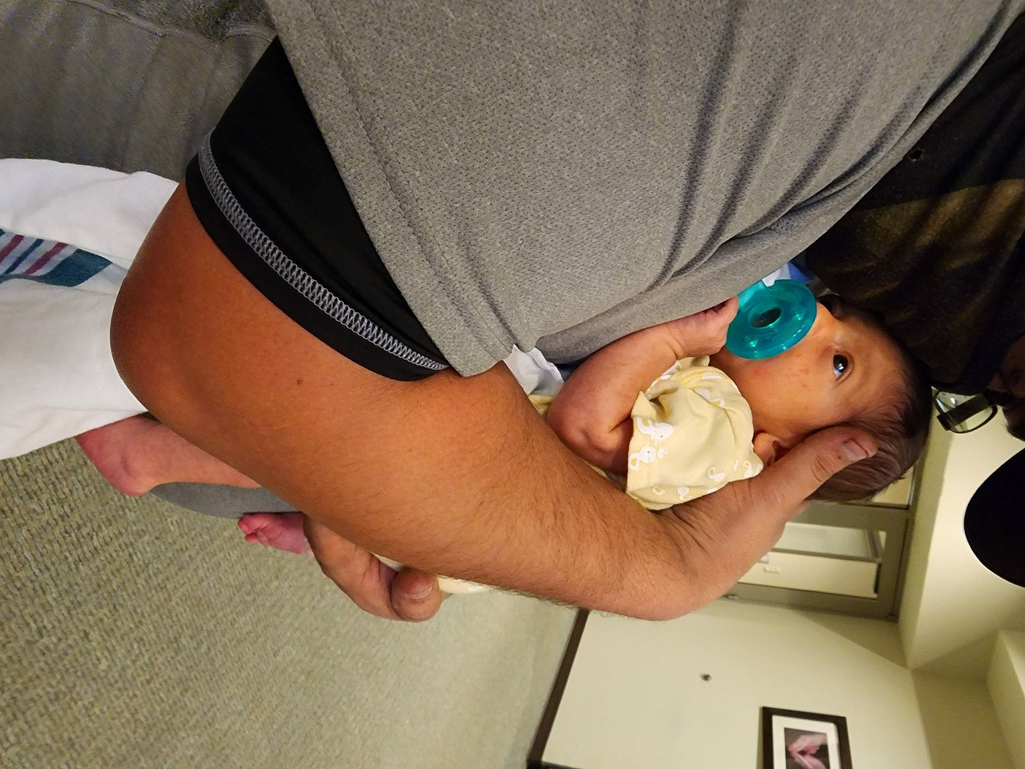 Xavier is registered to the contest to win money with this photo: abdomen, baby, child, comfort, elbow, finger, gesture, glasses, hat, human_body, human_leg, joint, knee, leg, nail, person, thigh, thumb, toddler, trunk