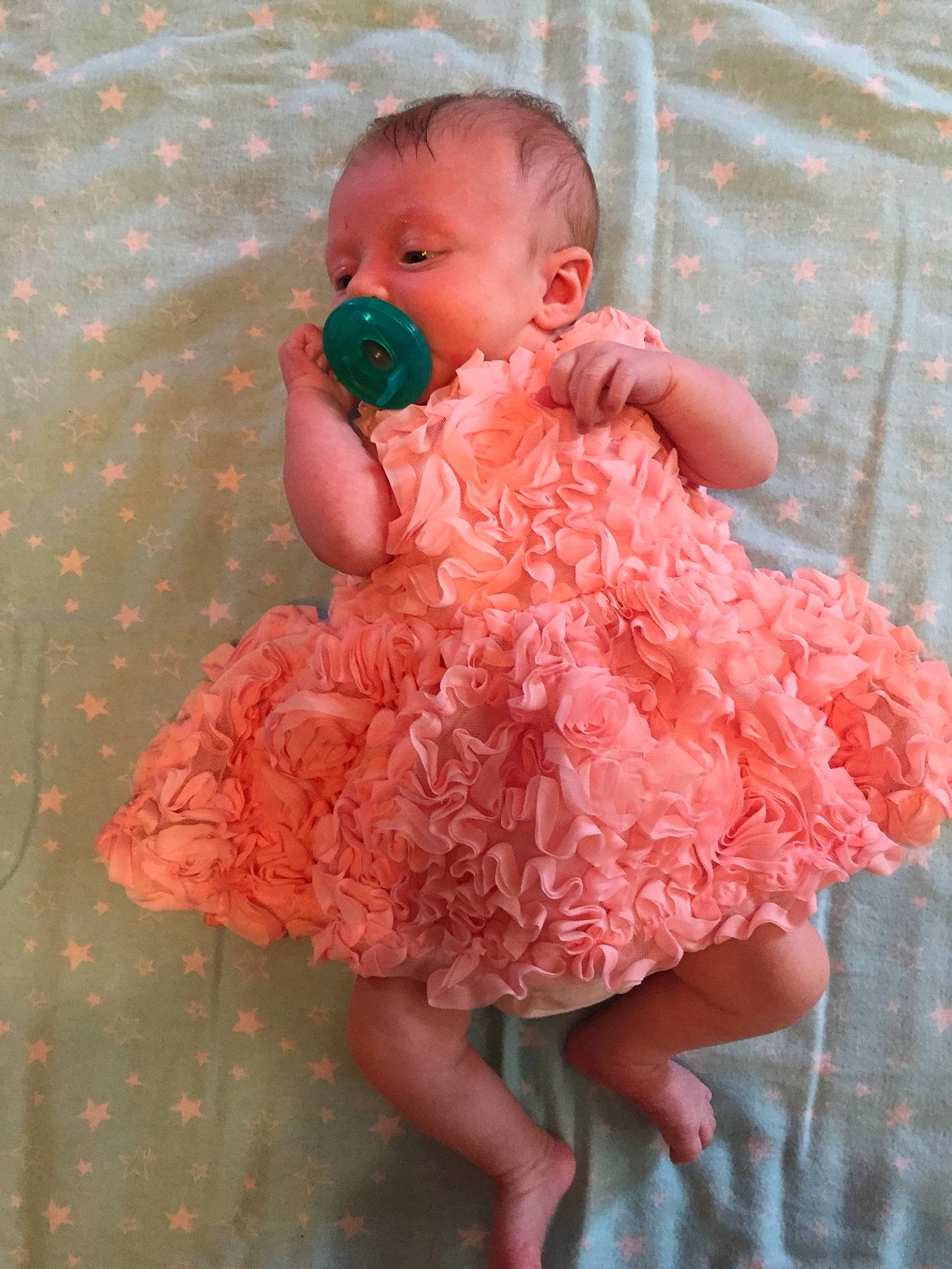 Beatrix is registered to the contest to win money with this photo: baby, baby_toddler_clothing, cheek, child, day_dress, dress, embellishment, face, happy, iris, lip, magenta, one_piece_garment, pattern, peach, person, pink, ruffle, skin, sleeve