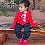 bench, casual, child, clothing, curious, daylight, desert, ground, nature, outdoor, pacifier, person, portrait, red_crocs, red_hoodie, rock, sitting, toddler, tree, young_child