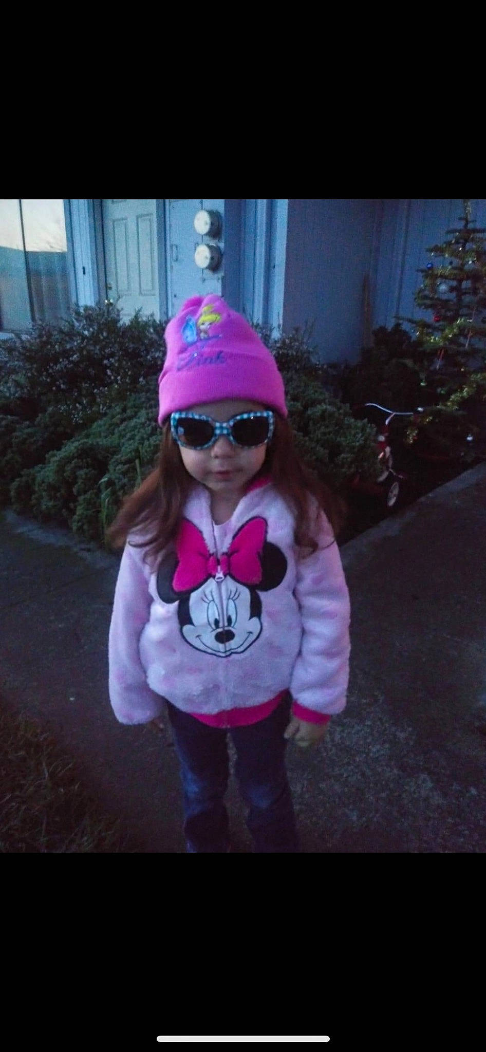 Isabel is registered to the contest to win money with this photo: clothing, cool, electric_blue, eyewear, glasses, goggles, grass, headwear, jacket, jeans, magenta, person, personal_protective_equipment, pink, plant, purple, sleeve, sunglasses, tints_and_shades, toddler