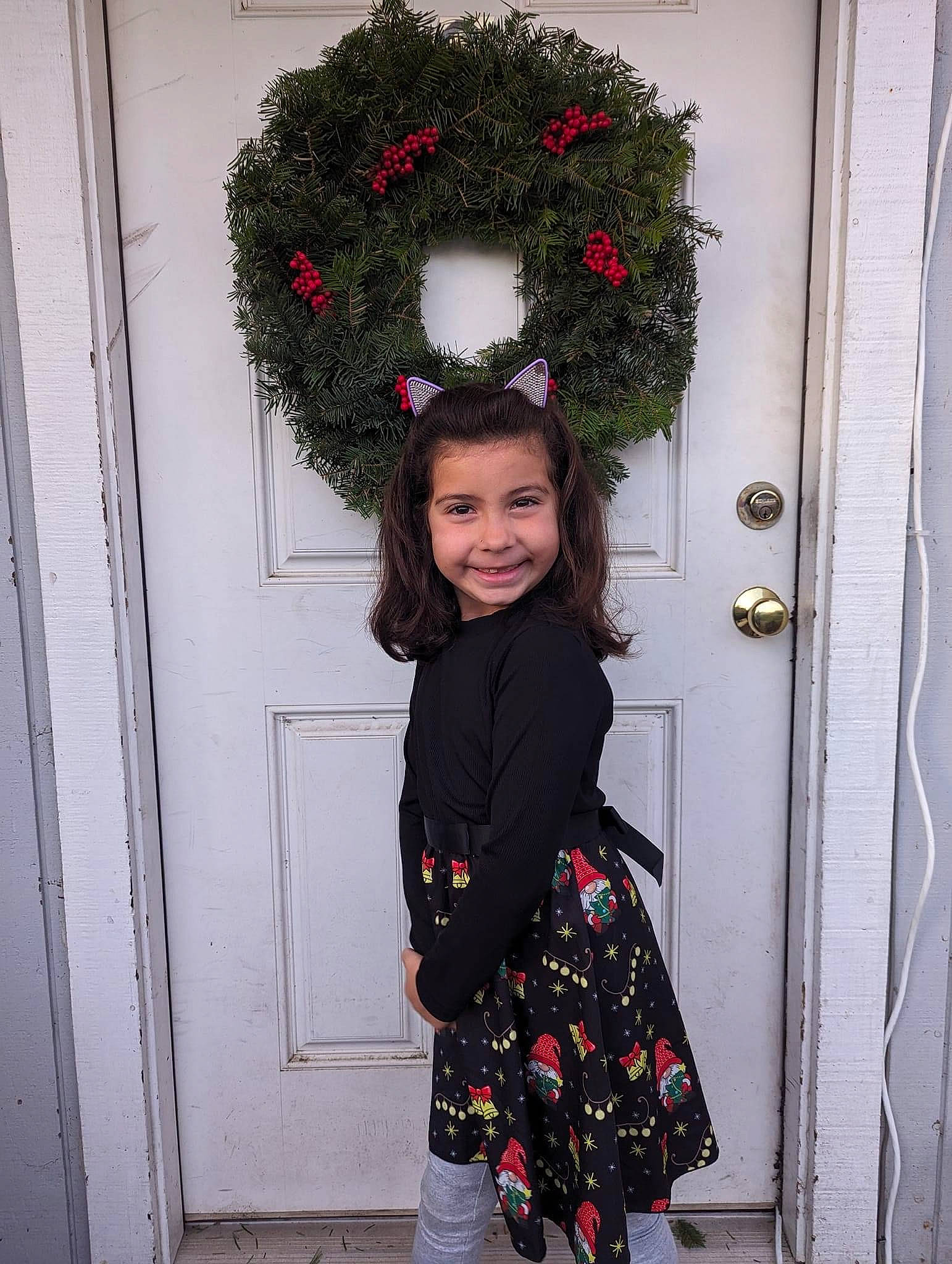 Isabel joined the competition — help win amazing prizes! christmas_decoration, door, event, eye, facial_expression, fashion_design, flower_arranging, happy, head, joy, magenta, pattern, person, photograph, pink, red, sleeve, smile, tree, twig