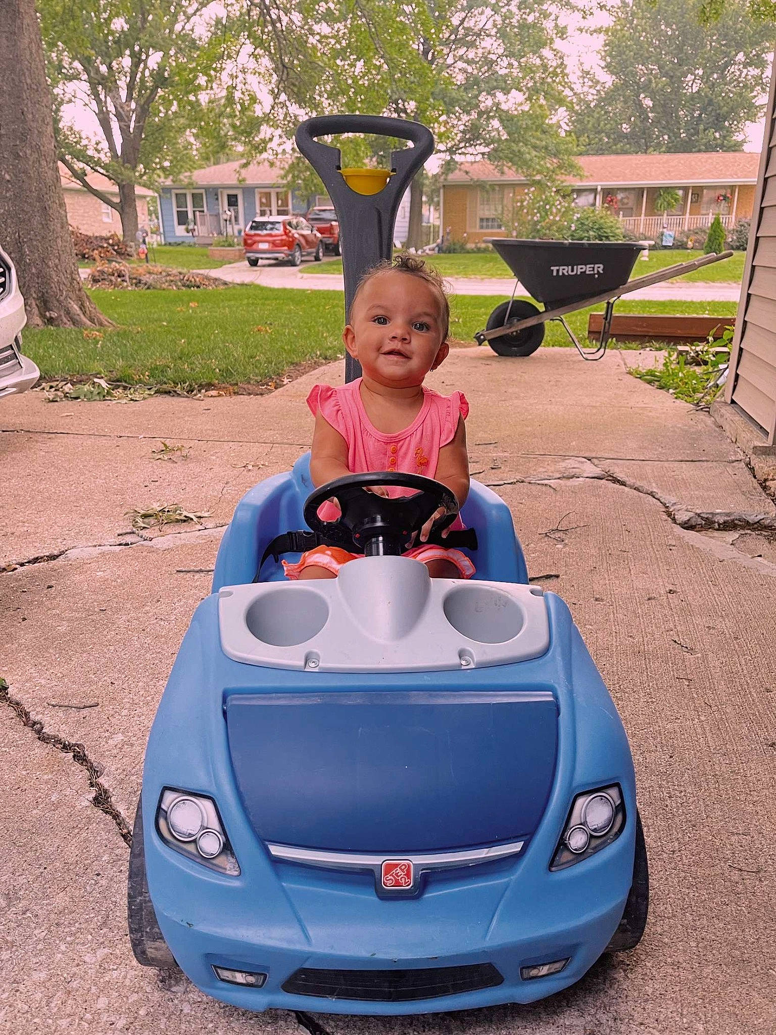 Emery joined the competition — help win amazing prizes! asphalt, automotive_design, automotive_exterior, automotive_lighting, automotive_tire, automotive_wheel_system, bumper, car, face, fender, hood, motor_vehicle, person, personal_luxury_car, plant, tire, toddler, travel, tree, vehicle