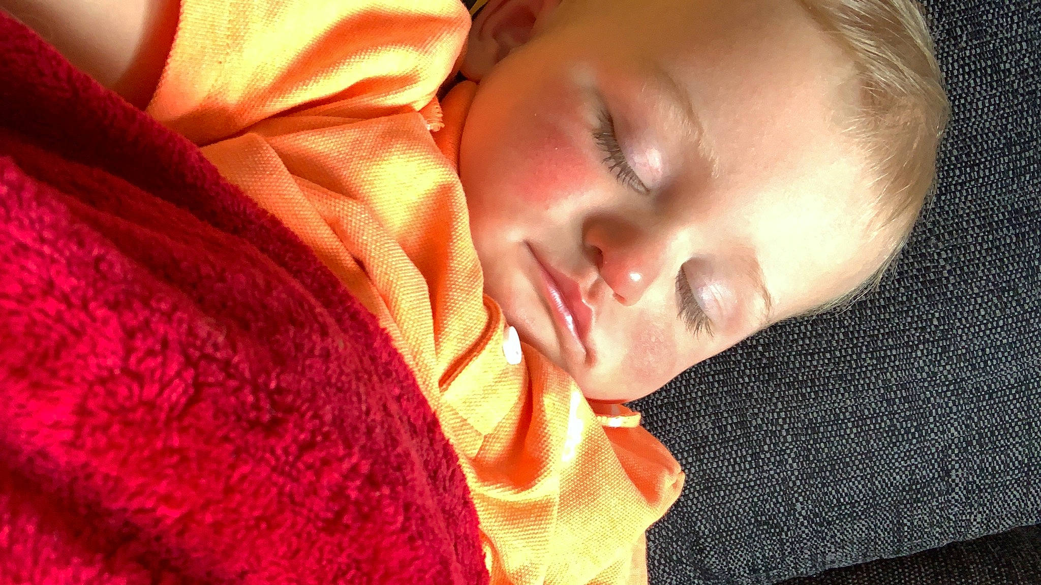 Dexter is registered to the contest to win money with this photo: baby, baby_toddler_clothing, cheek, comfort, eyebrow, eyelash, hand, happy, headgear, human_body, iris, lip, mouth, neck, nose, orange, person, skin, sleeve, textile