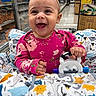 Ailani is registered to the contest to win money with this photo: aisle, baby, child, cute, floral_pattern, happy, headband, holding, indoor, infant, pink_clothing, playful, portrait, products, seat_cover, shopping, shopping_cart, smile, supermarket, toy
