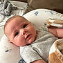 Sawyer is registered to the contest to win money with this photo: baby, infant, blanket, pillow, plush_toy, elephant, face, skin, gray_shirt, couch, soft_toy, cute, child, comfort, indoor, portrait, sleepy, resting, cozy, closeup