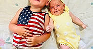 Wayland Bragg joined the competition — help win amazing prizes! baby, blanket, child, cute, family, flower, happy, headband, indoor, lying_down, months_tracker, pattern, playful, portrait, shorts, sibling, smile, sock, tank_top, yellow_outfit