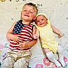 Wayland Bragg joined the competition — help win amazing prizes! child, baby, sibling, smile, happy, blanket, pattern, flower, months_tracker, tank_top, shorts, yellow_outfit, headband, sock, lying_down, indoor, cute, family, portrait, playful