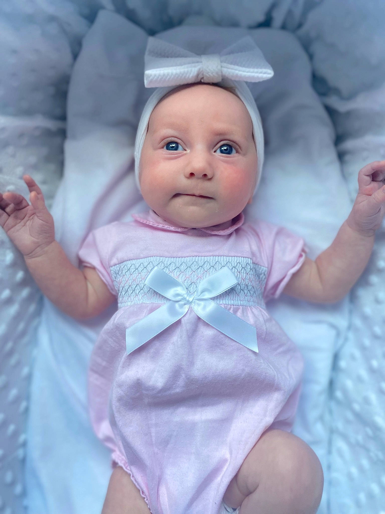 Poppy is registered to the contest to win money with this photo: baby, baby_products, baby_toddler_clothing, cheek, child, comfort, doll, eyebrow, eyelash, finger, gesture, head, headwear, linens, person, pink, purple, skin, sleeve, textile