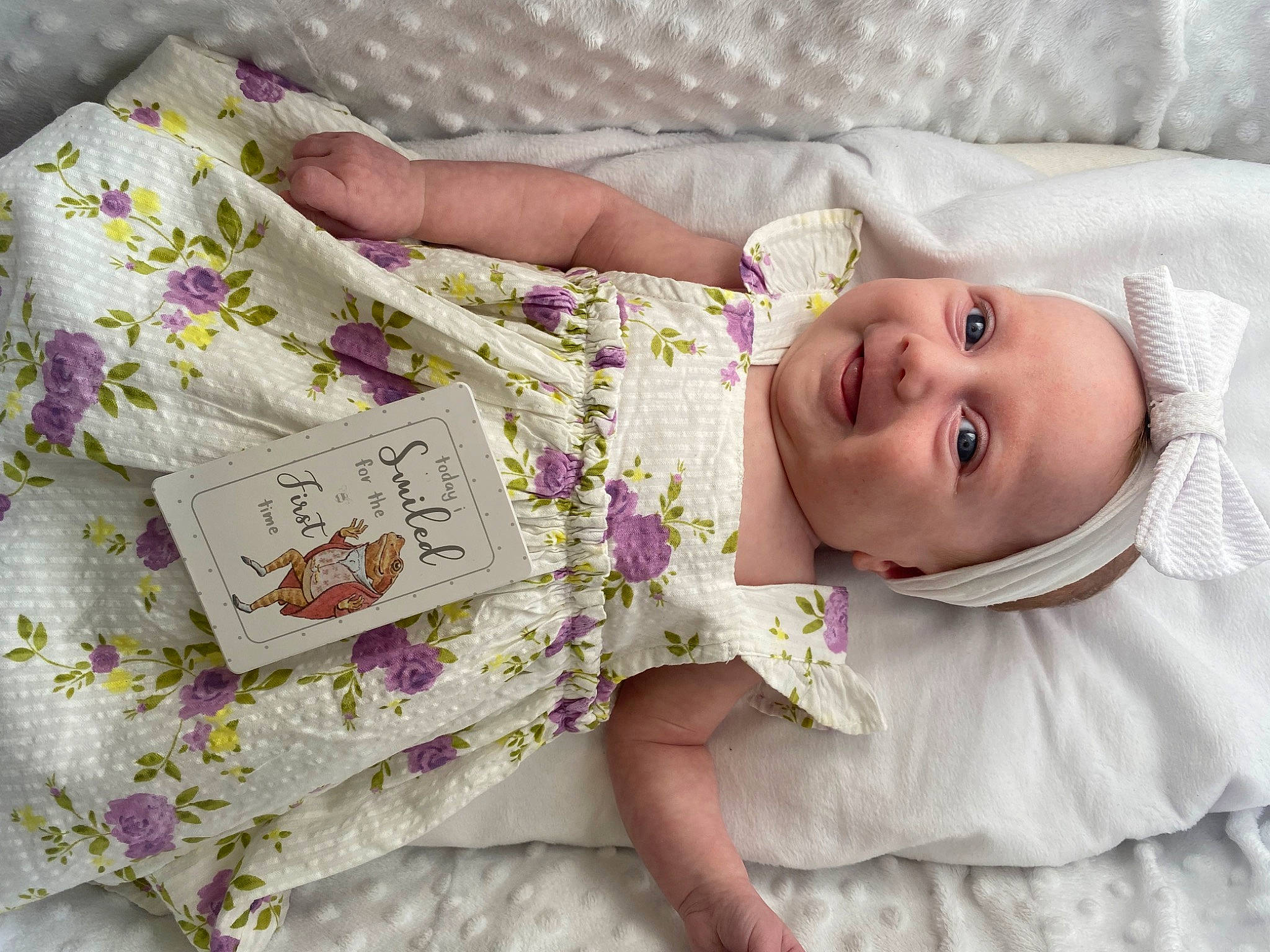 Poppy joined the competition — help win amazing prizes! baby, baby_toddler_clothing, bedding, child, comfort, dress, eye, happy, head, headwear, human_body, joy, linens, pattern, person, petal, pink, purple, skin, sleeve