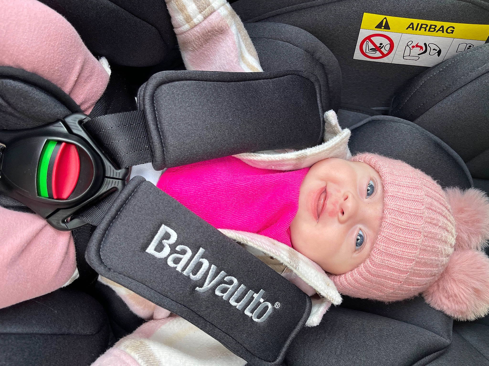 Amy joined the competition — help win amazing prizes! auto_part, baby, baby_carriage, baby_in_car_seat, baby_toddler_clothing, black, car_seat, child, comfort, finger, glasses, headgear, headwear, material_property, person, pink, product, seat_belt, smile, textile