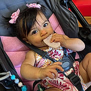 Zaira joined the competition — help win amazing prizes! baby, beads, child, clothing, comfort, cute, expression, eyes, face, hair_bows, hand, indoor, infant, munching, pink, portrait, seatbelt, snack, stroller, toy