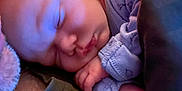 Lennox is registered to the contest to win money with this photo: baby, blanket, closeup, clothing, comfort, cozy, cute, face, hand, indoor, infant, newborn, peaceful, person, portrait, rest, sleeping, soft, toddler, warm_light