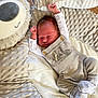 baby, blanket, clothing, cozy, cute, face, head, indoors, infant, newborn, overalls, peaceful, person, plush, resting, sleeping, socks, soft_texture, toddler, wood_floor