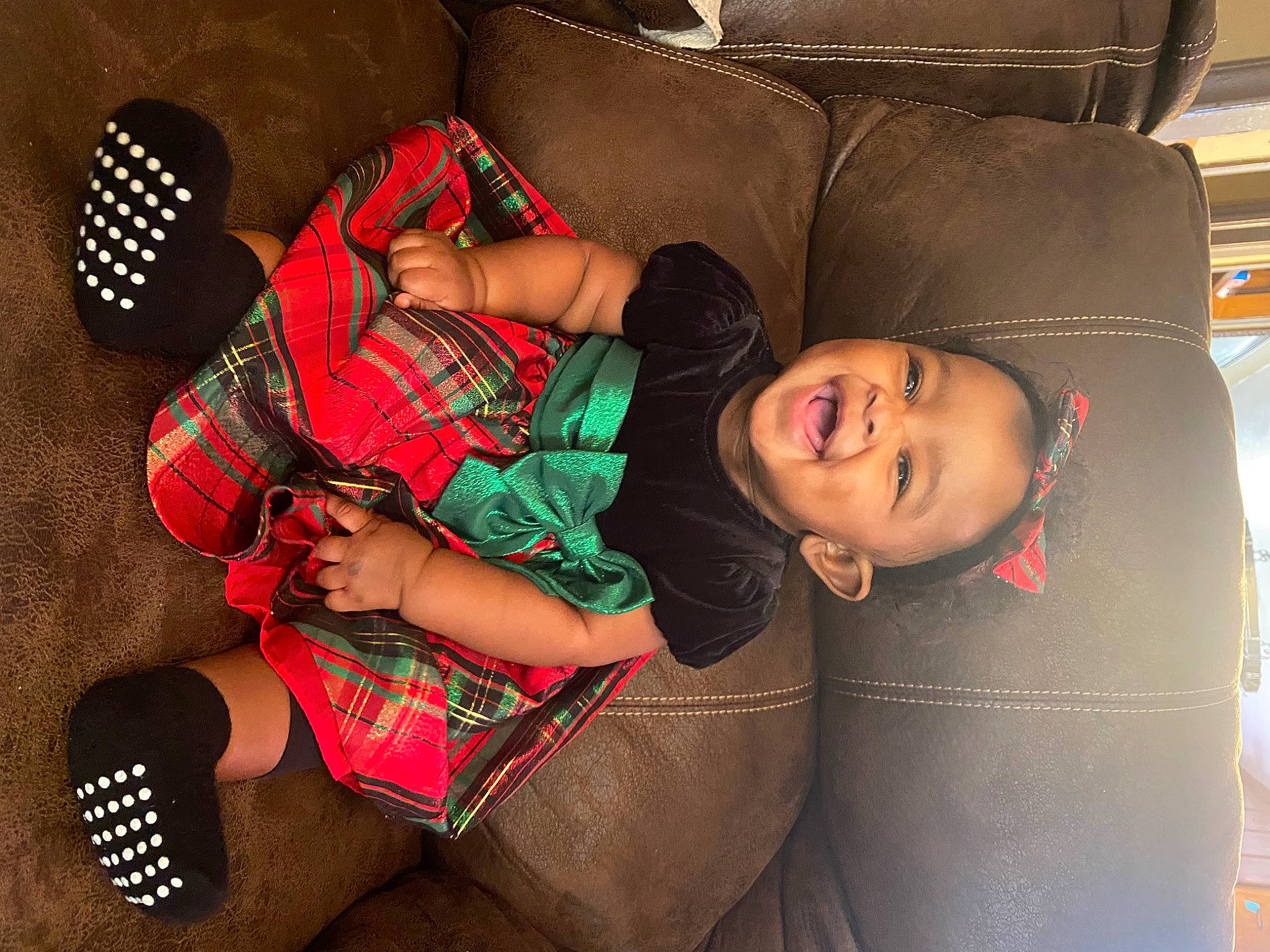 Ravyn is registered to the contest to win money with this photo: black_hair, child, comfort, cool, elbow, fashion, fun, human_leg, joint, knee, lap, leg, luggage_and_bags, person, plaid, room, sitting, smile, tartan, textile