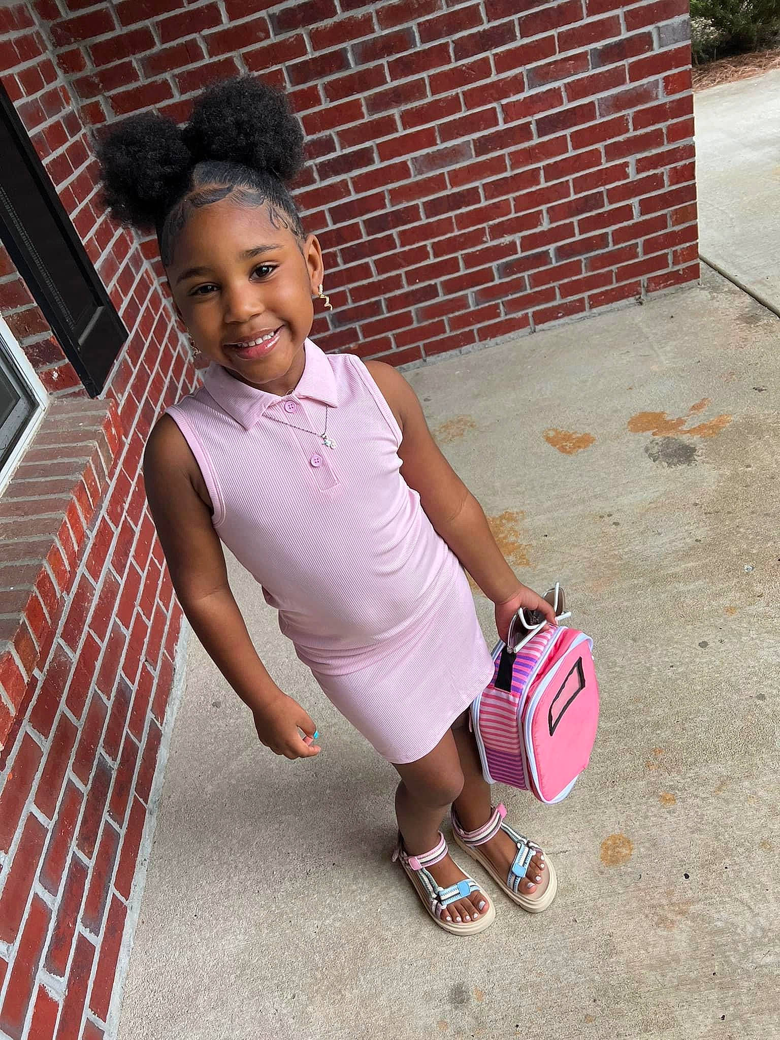 Zariyah is registered to the contest to win money with this photo: ball, brick, brickwork, child, concrete, cool, fun, happy, human_leg, joy, knee, leisure, magenta, person, pink, sandal, shorts, smile, street, t_shirt