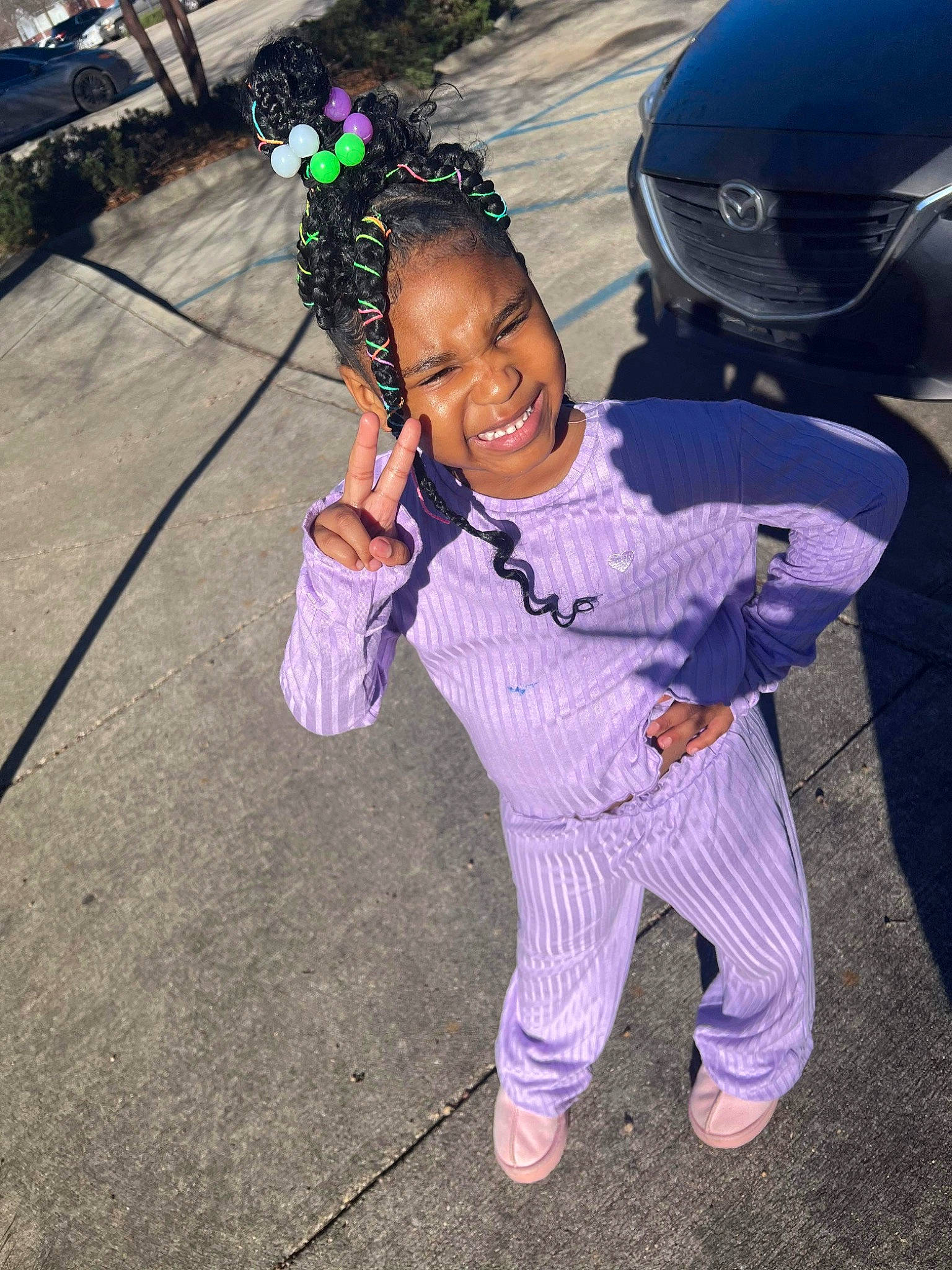 Zariyah joined the competition — help win amazing prizes! automotive_exterior, automotive_lighting, bicycle_helmet, bumper, car, electric_blue, event, fun, happy, hood, joy, leisure, luxury_vehicle, person, pink, plant, purple, smile, sneakers, sports_gear