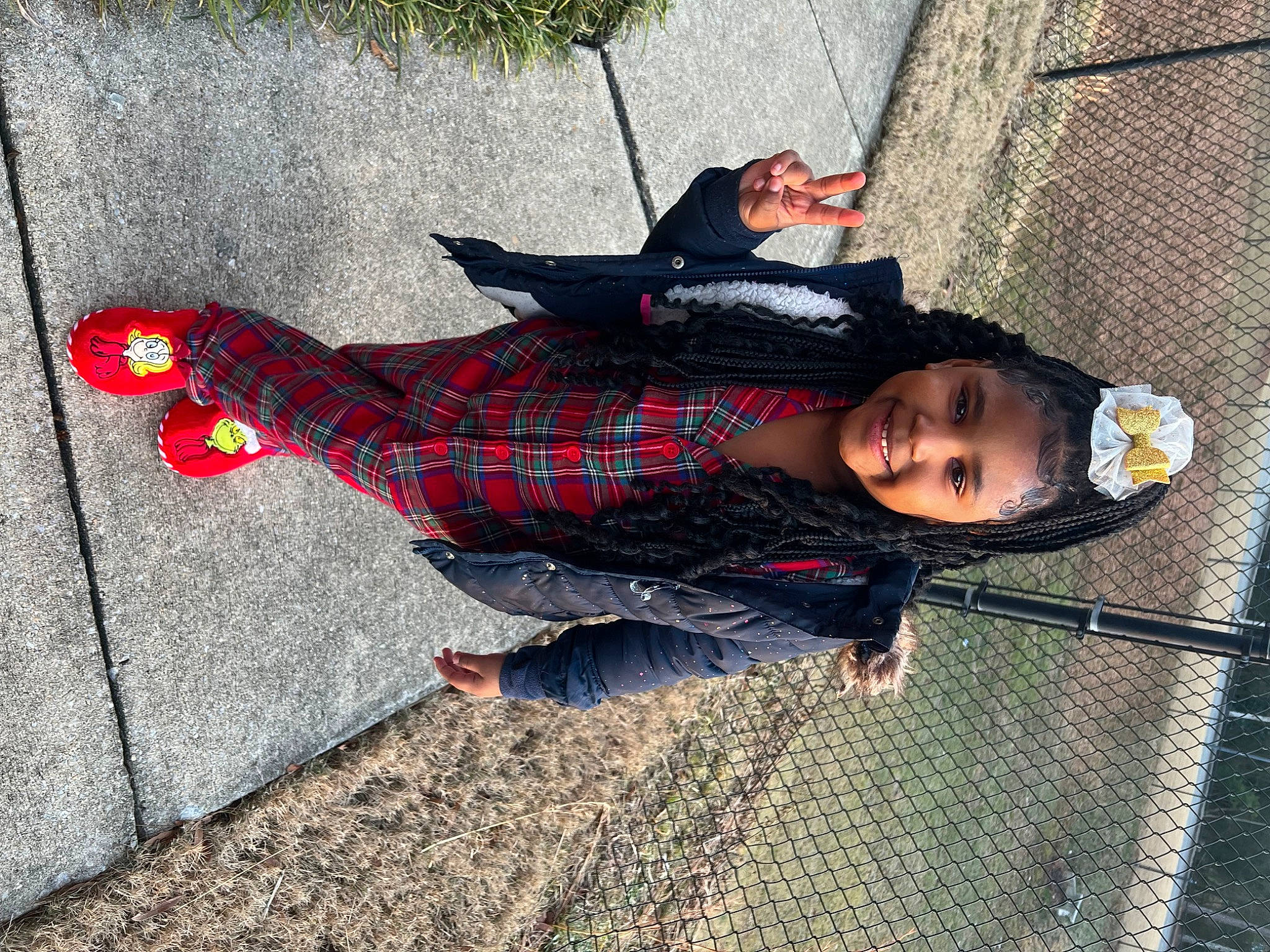 Zariyah is registered to the contest to win money with this photo: carmine, child, concrete, flooring, fun, grass, human_leg, joy, mesh, pattern, person, plaid, plant, road_surface, shadow, sidewalk, sitting, smile, tartan, tints_and_shades