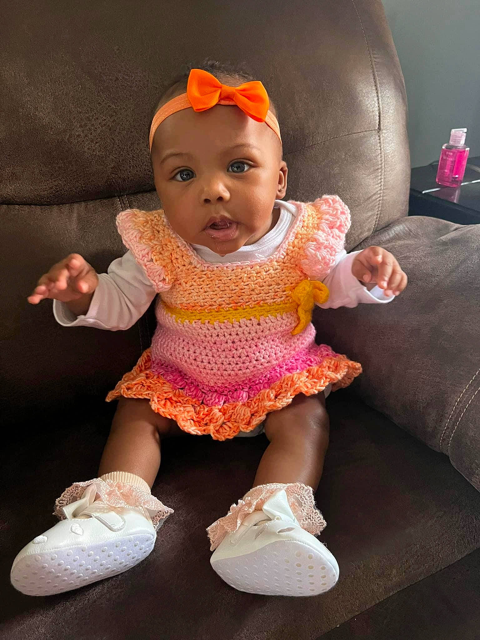 Kehlani joined the competition — help win amazing prizes! baby, baby_toddler_clothing, cheek, child, couch, doll, eye, eyelash, fashion_accessory, human_leg, iris, lip, pattern, person, pink, sitting, sleeve, sneakers, sock, textile