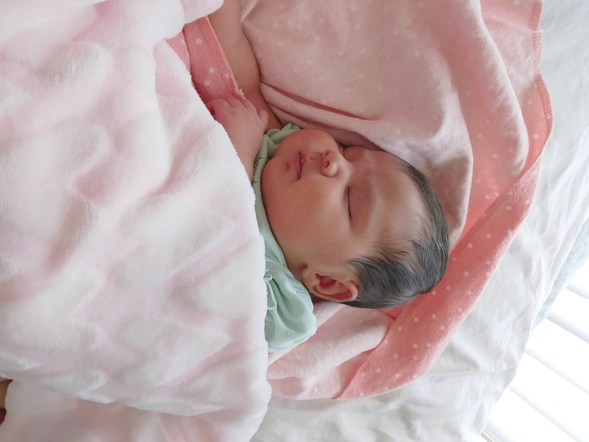 Dahlia is registered to the contest to win money with this photo: baby, baby_products, baby_toddler_clothing, bed, bed_sheet, bedding, bedtime, child, childbirth, comfort, event, hand, human_body, linens, nap, peach, person, pink, room, sleep