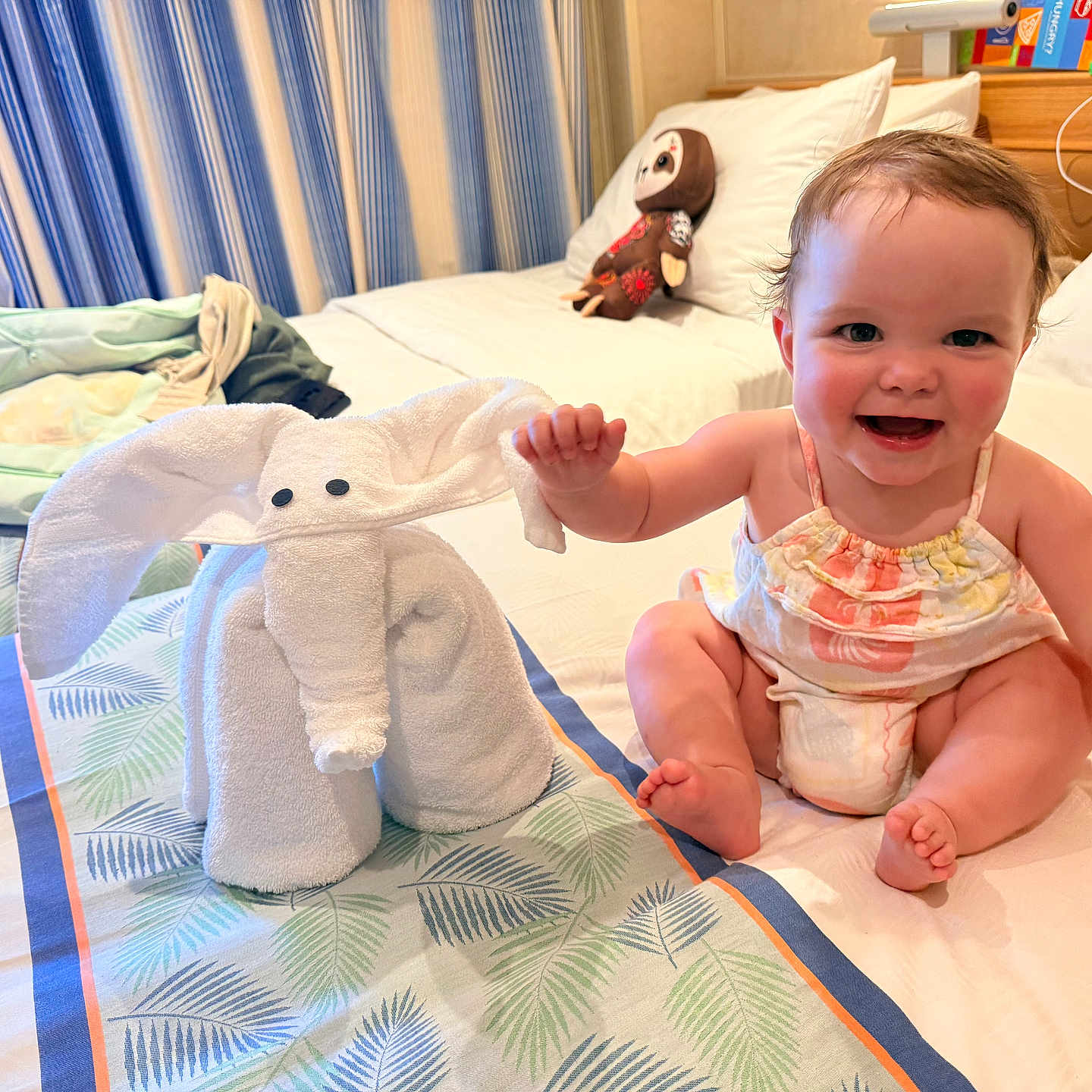 Everleigh joined the competition — help win amazing prizes! baby, towel, elephant, bed, smiling, child, indoor, toy, pillow, curtains, fabric, furniture, cute, happy, person, infant, room, decor, clothing, soft