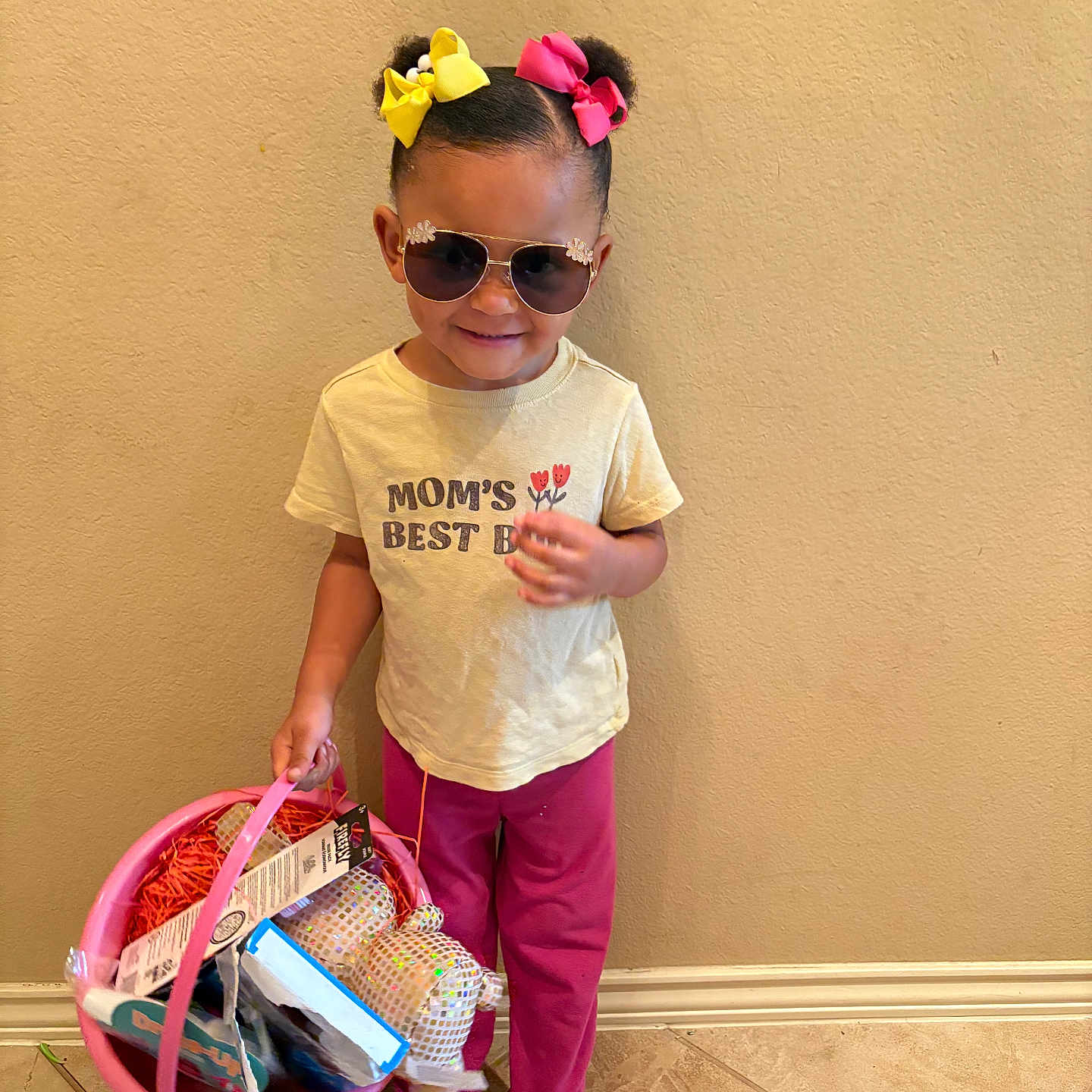 Sincerely joined the competition — help win amazing prizes! accessory, barefoot, basket, bows, casual_clothing, child, cute, indoor, pants, person, pink, shirt, smile, standing, sunglasses, tile_floor, toddler, wall, yellow, young_child