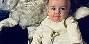 Enoan a rejoint le concours — aidez-le/la à gagner de superbes lots ! baby, child, santa_claus, beard, glasses, gloves, winter, holiday, christmas, portrait, indoor, costume, festive, smile, person, face, decor, seated, white, fur