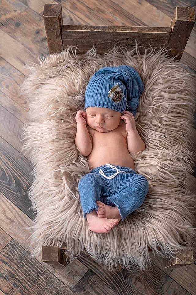 Wade is registered to the contest to win money with this photo: abdomen, azure, barefoot, denim, electric_blue, fashion_accessory, feather, foot, fur, headpiece, headwear, helmet, human_leg, jewellery, leg, person, sitting, thigh, trunk, wig